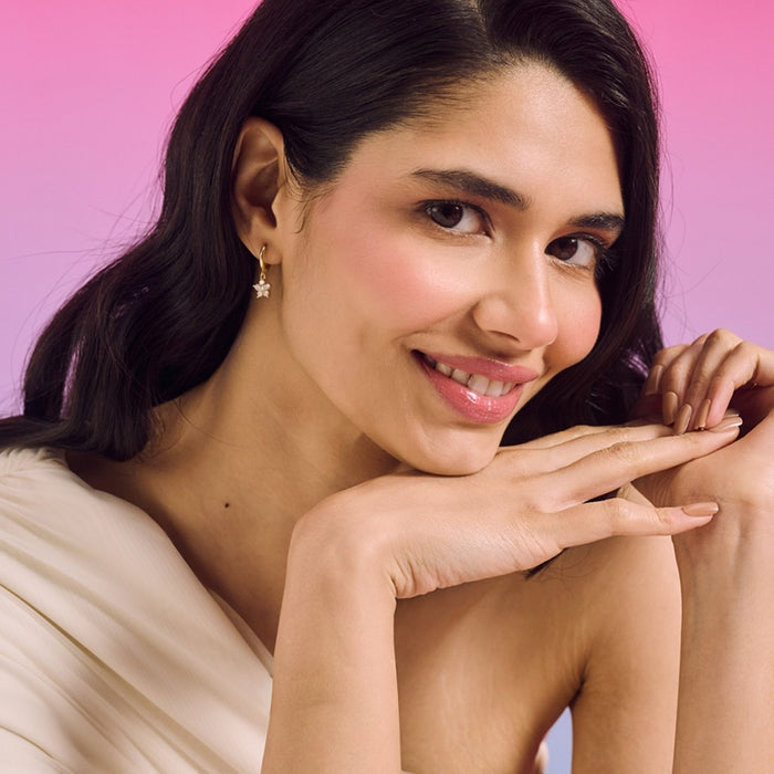 Woman wearing 925 Sterling Silver gold plated falling star hoop earrings. Fine jewellery for women. – Zavya