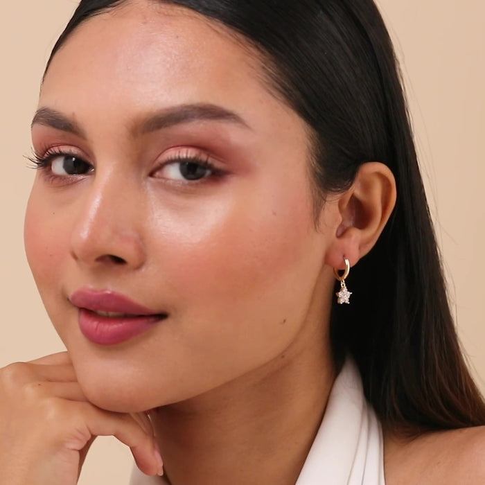Woman wearing 925 Sterling Silver gold plated falling star hoop earrings for women. – Zavya