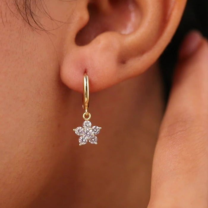Gold plated 925 Sterling Silver hoop earrings for women with a sparkling star drop worn on ear. – Zavya
