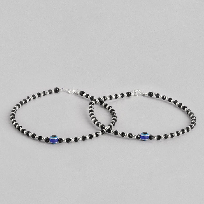 Two 925 Sterling Silver anklets for women featuring black beads and a blue evil eye. Fine jewellery – Zavya