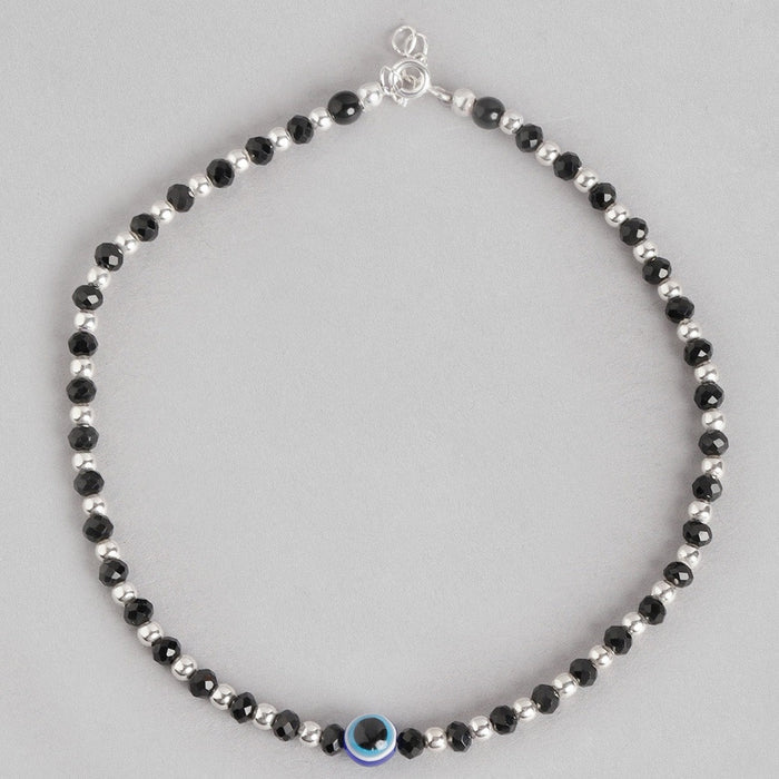Women's 925 Sterling Silver anklet featuring alternating black beads and a blue evil eye charm. – Zavya