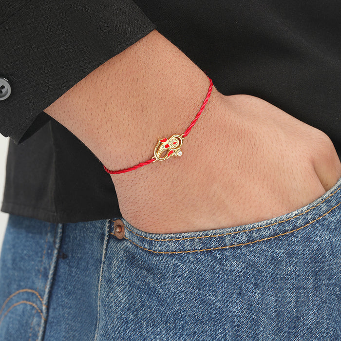 Auspicious Lord Ganesh Ji CZ Gold Plated Silver Thread Rakhi