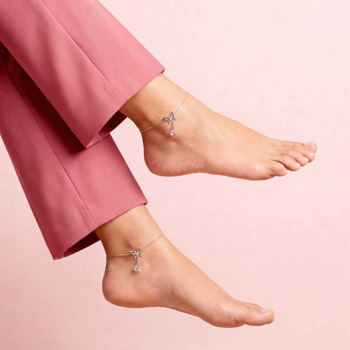 Woman wearing a 925 Sterling Silver butterfly anklet. Elegant silver anklets for women. – Zavya