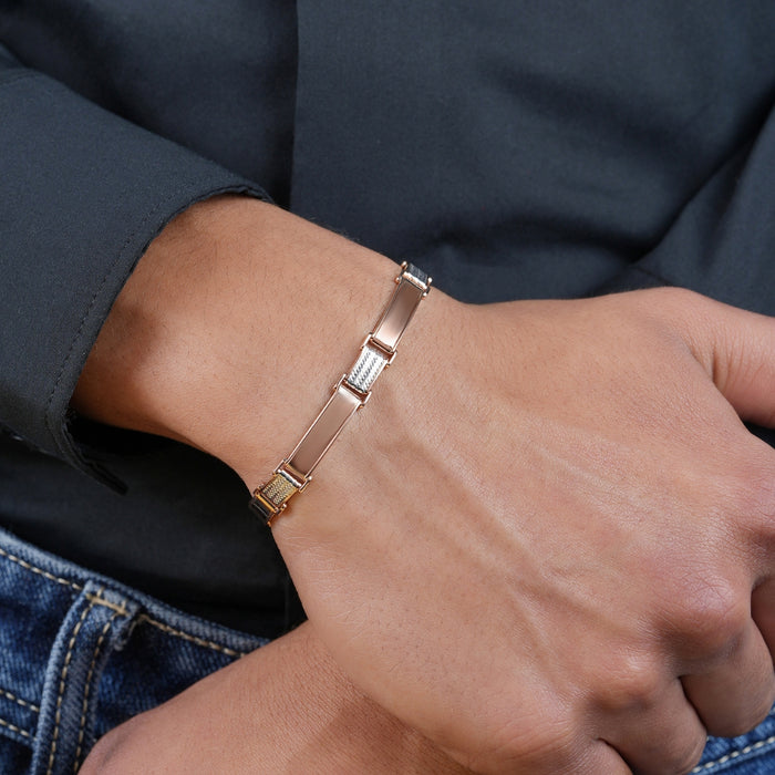 Man in black shirt wearing a rose gold & 925 Sterling Silver men's bracelet. Jewellery gift for him – Zavya