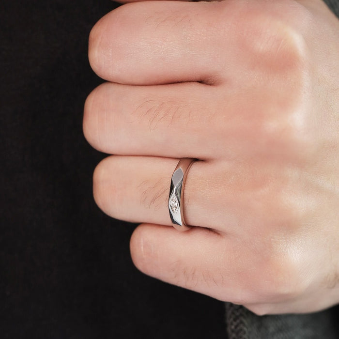 Man's hand wearing a CZ studded 925 Sterling Silver ring. Ideal men's jewellery gift for him – Zavya
