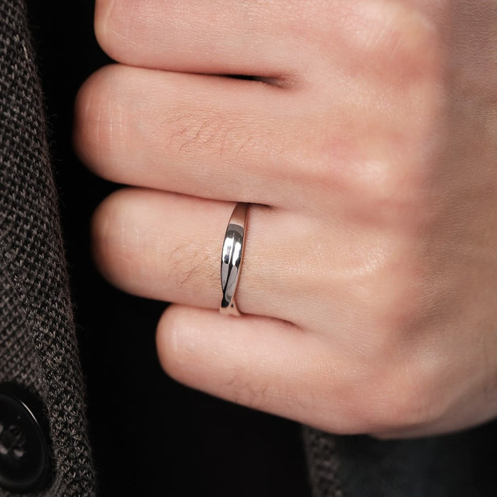 Man wearing a Crossed Paths 925 Sterling Silver ring. Perfect jewelry gift for him. – Zavya