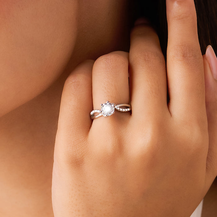 Woman wearing a sparkling 925 Sterling Silver solitaire ring. Beautiful silver rings for women – Zavya