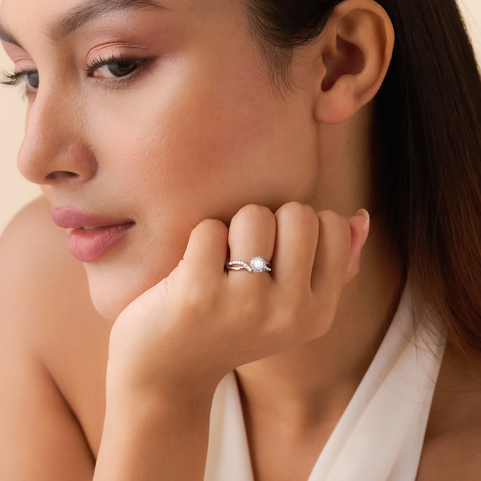 Woman showcasing a 925 Sterling Silver solitaire ring on her hand. Elegant silver jewellery for women – Zavya