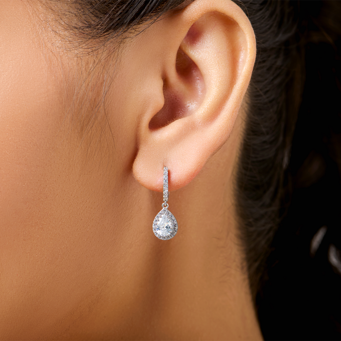 Woman wearing 925 Sterling Silver crystal teardrop earrings. Elegant silver jewellery for women – Zavya