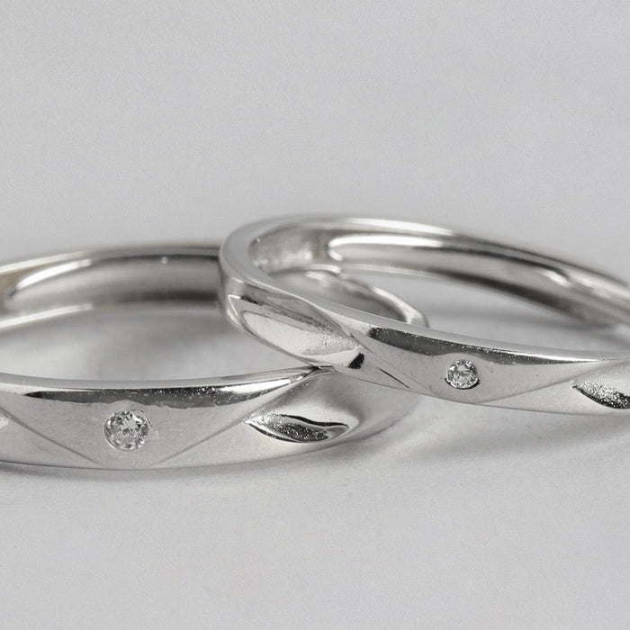 Two 925 Sterling Silver couple band rings for women featuring a single CZ stone on each – Zavya