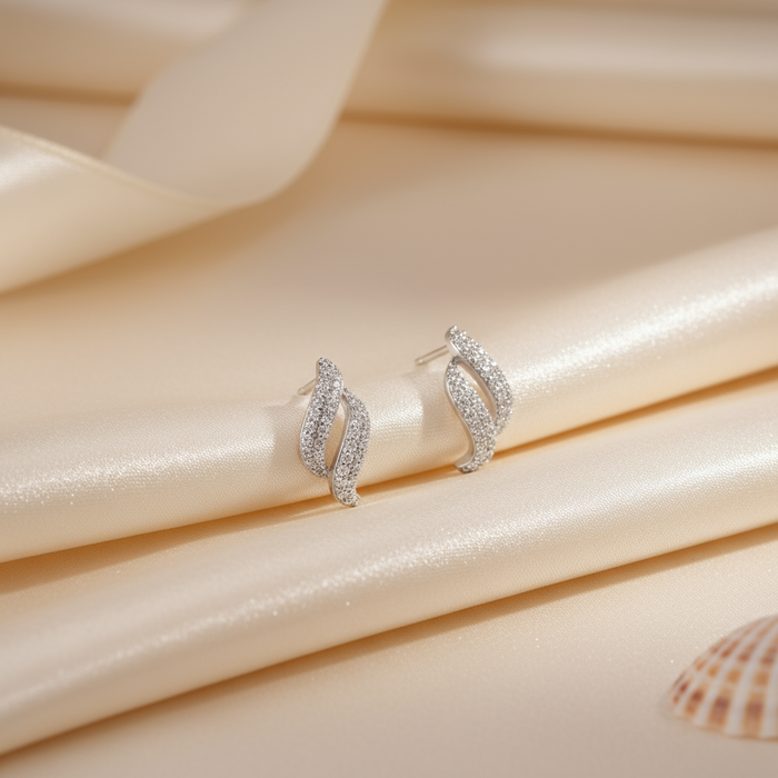925 Sterling Silver dancing wave stud earrings for women. Sparkling rhodium plated jewellery on satin – Zavya