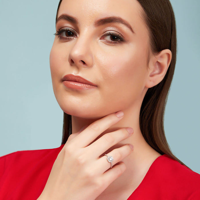 Woman in red wearing a 925 Sterling Silver solitaire ring. Beautiful women's jewellery. – Zavya