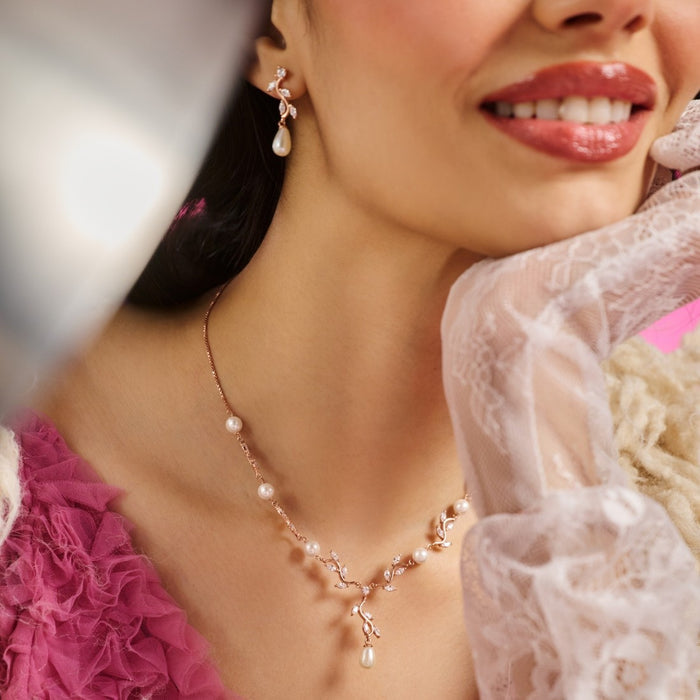 Smiling woman wearing a rose gold-plated 925 Sterling Silver pearl and CZ pendant necklace – Zavya