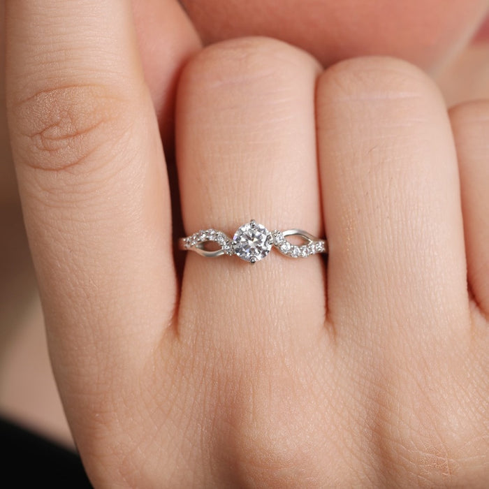 Woman's hand wearing a 925 Sterling Silver adjustable CZ diamond ring. Women's jewellery – Zavya