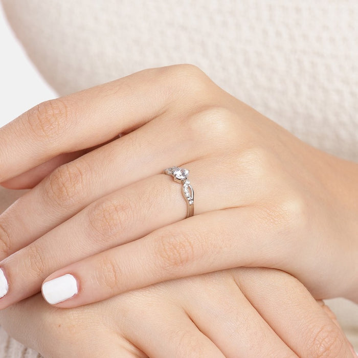Woman's hand wearing a sparkling CZ 925 Sterling Silver ring. Elegant silver jewellery for women – Zavya