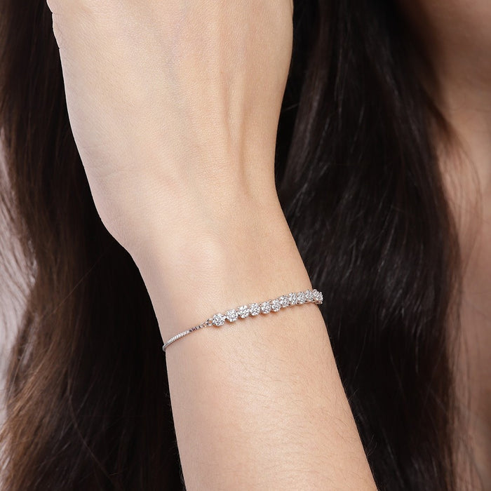 Woman wearing a delicate floral 925 Sterling Silver bracelet. Elegant silver jewellery for women – Zavya