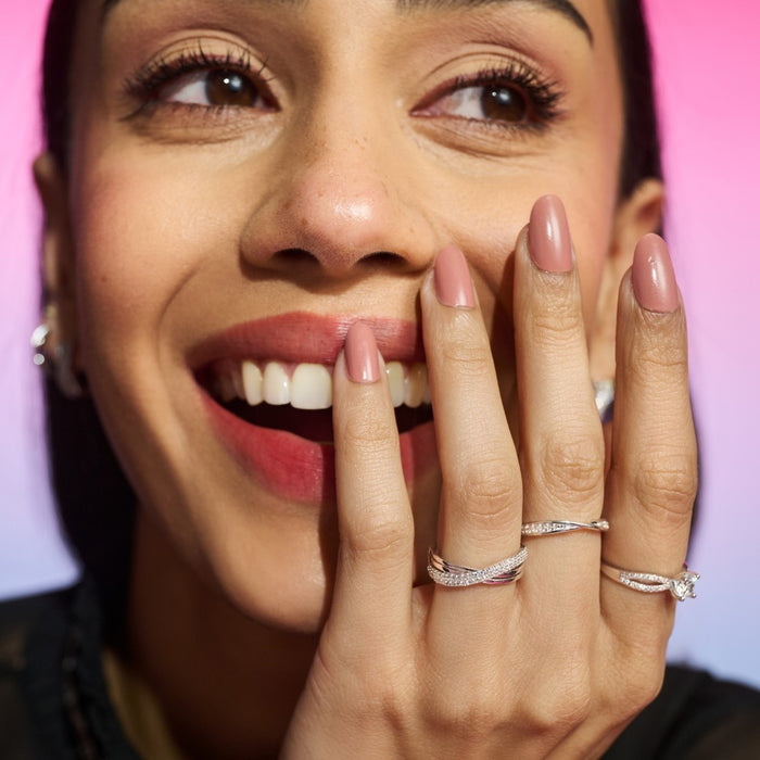 Smiling woman wearing a 925 Sterling Silver adjustable solitaire ring. Women's silver rings – Zavya