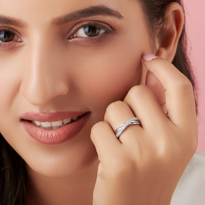 Smiling woman wearing a 925 Sterling Silver cross ring with stones. Rhodium plated women's jewellery – Zavya