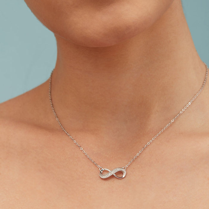Woman wearing an infinity pendant 925 Sterling Silver necklace. Elegant silver jewelry for women – Zavya
