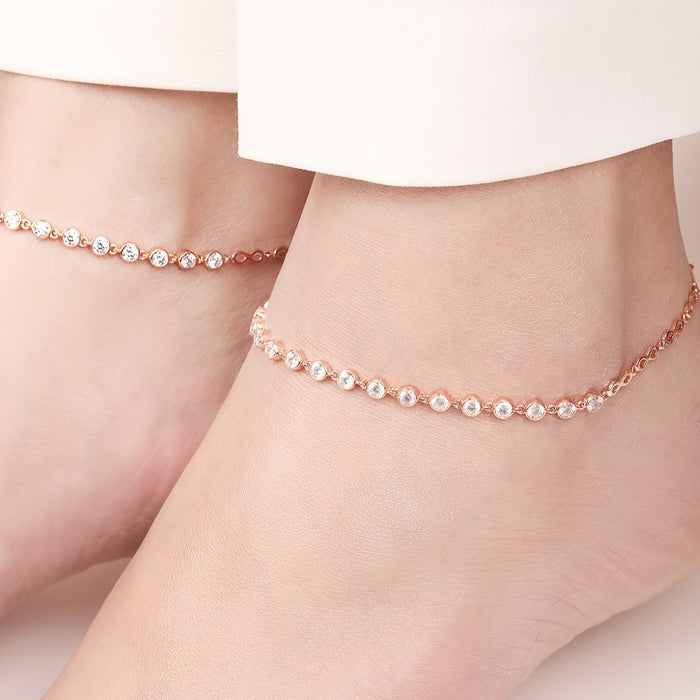 Woman wearing rose gold-plated 925 Sterling Silver anklets with round crystals. Jewellery for women – Zavya