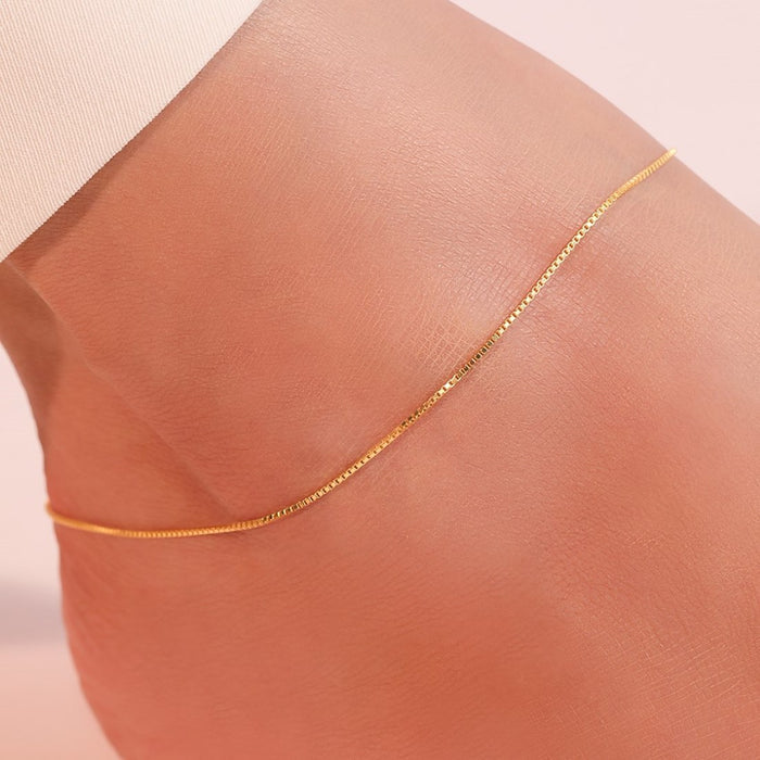 Gold-plated 925 Sterling Silver box chain anklet on a woman's ankle. Everyday women's jewellery – Zavya