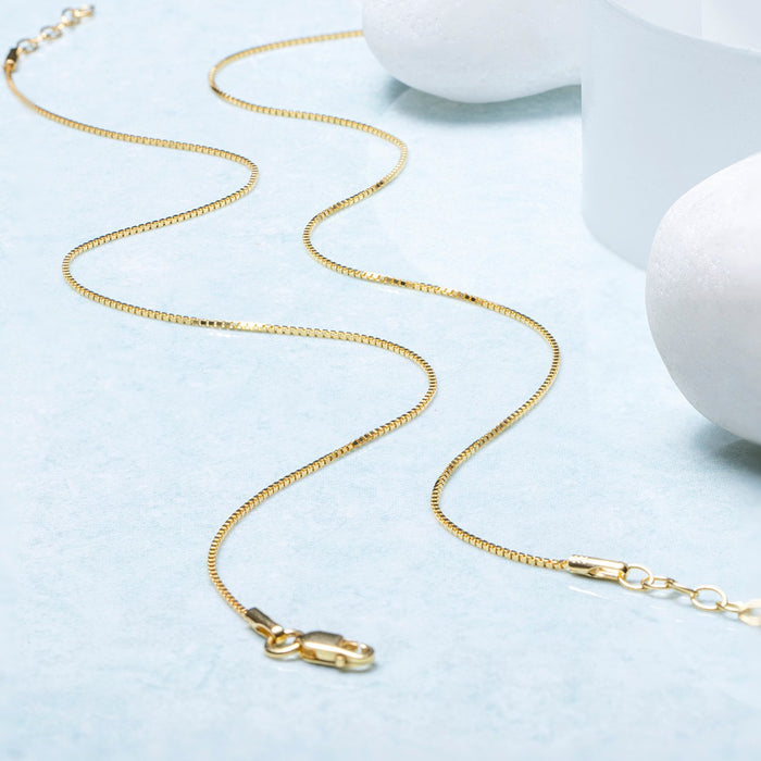 Everyday gold-plated 925 Sterling Silver box chain anklet for women on a light blue surface – Zavya