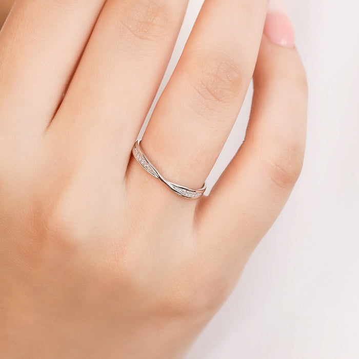 Woman wearing a delicate 925 Sterling Silver twist ring. Everyday minimalist jewelry for women – Zavya