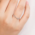 Woman wearing a delicate 925 Sterling Silver twist ring. Everyday minimalist jewelry for women – Zavya