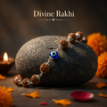 Evil Eye Rudraksha Bracelet with blue Evil Eye charm and silver-toned caps
