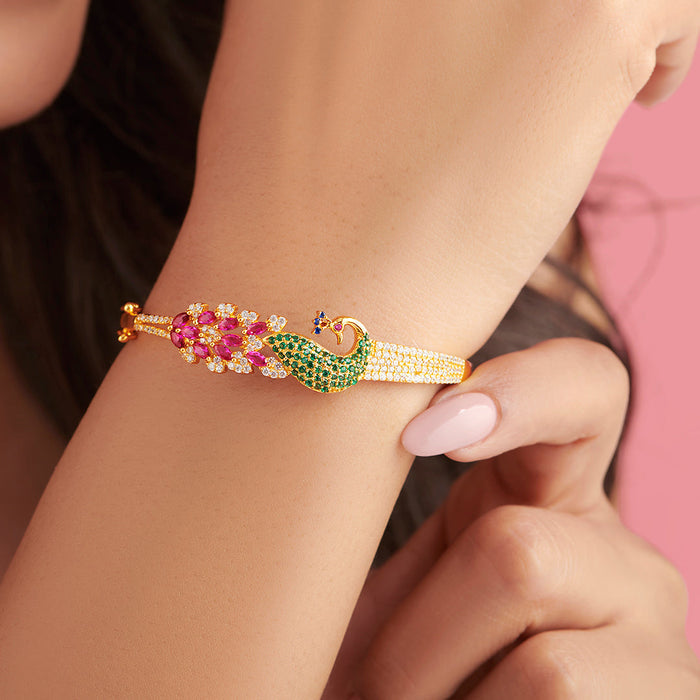 Woman wearing a 925 Sterling Silver peacock bracelet with pink and green gemstones – Zavya