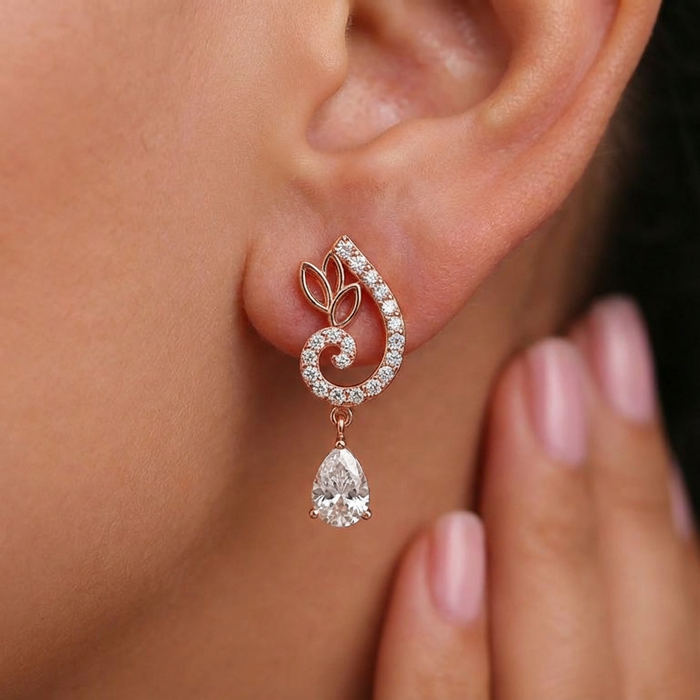 Woman wearing rose gold 925 Sterling Silver drop earrings with a sparkling crystal teardrop – Zavya