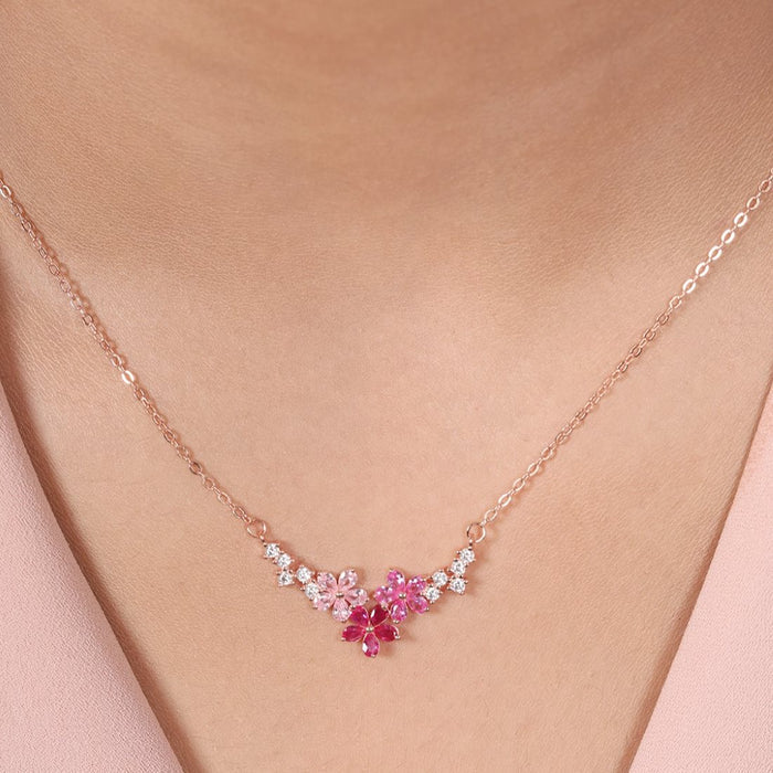 Woman wearing a 925 Sterling Silver rose gold-plated flower necklace with pink stones. Women's jewellery – Zavya