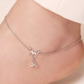 Woman wearing a 925 Sterling Silver butterfly anklet with dangling crystals. Elegant women's jewellery – Zavya