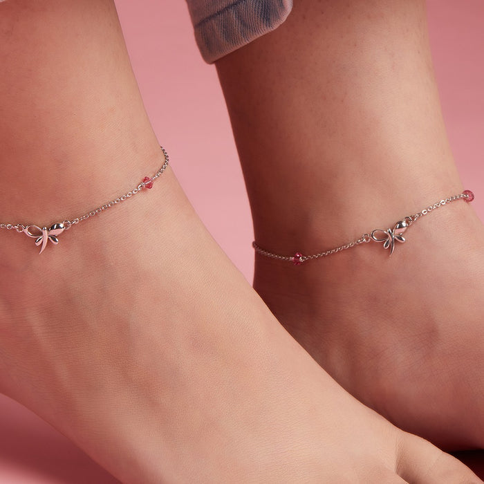 Woman wearing 925 Sterling Silver butterfly anklets with studded pink stones. Elegant women's jewelry. – Zavya