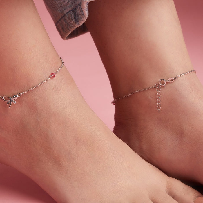Woman wearing 925 Sterling Silver butterfly anklets with a studded pink stone. Women's jewellery – Zavya