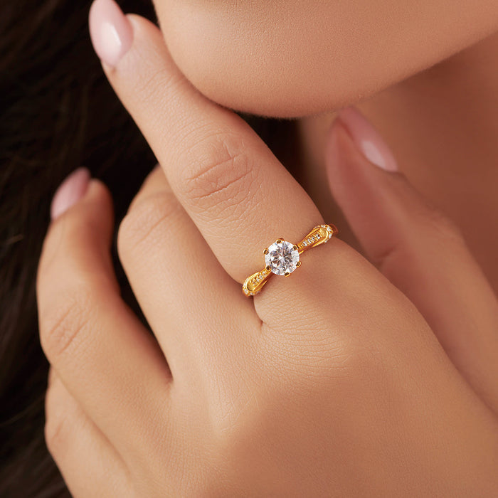 Woman wearing a gold plated 925 Sterling Silver ring with a sparkling stone. Jewelry for women – Zavya