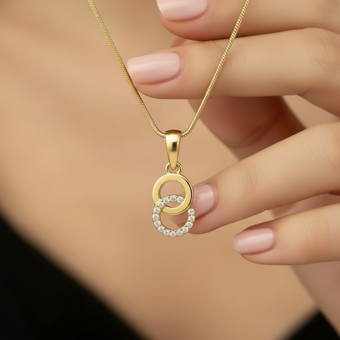 Woman holding a gold-plated 925 Sterling Silver interlocking CZ pendant necklace for women – Zavya