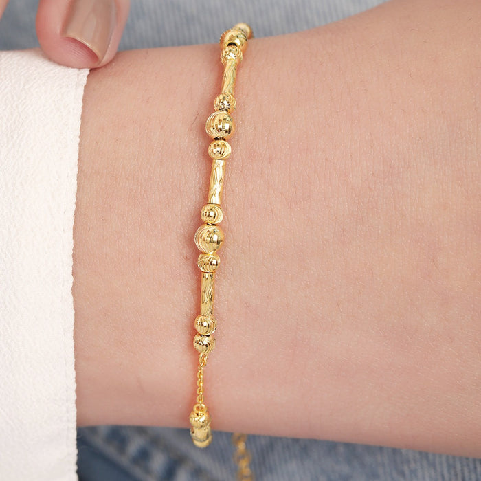 Gold plated 925 Sterling Silver beaded bracelet on a woman's wrist. Everyday women's jewellery – Zavya
