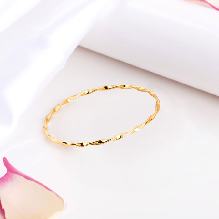Gold-plated 925 Sterling Silver twisted bangle bracelet for women on white with petals – Zavya