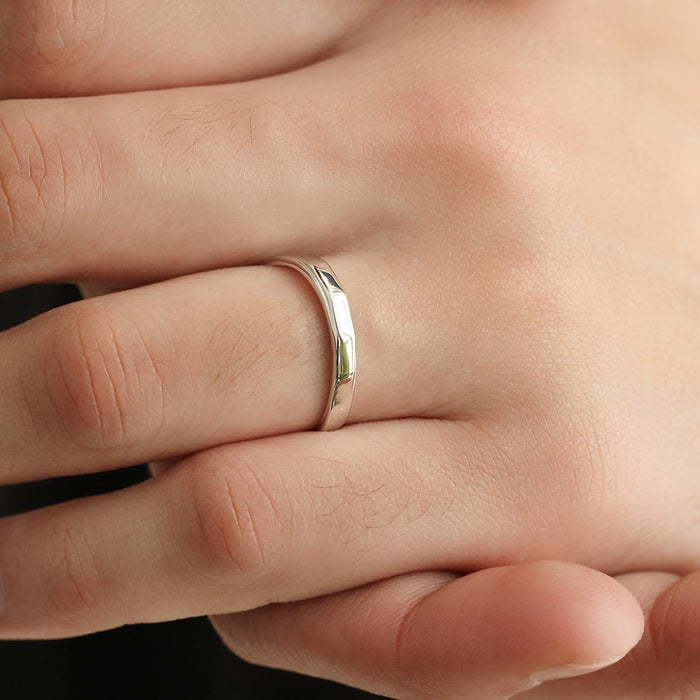 Close-up of a man's hand wearing a sleek 925 Sterling Silver ring. Ideal jewellery gift for him – Zavya