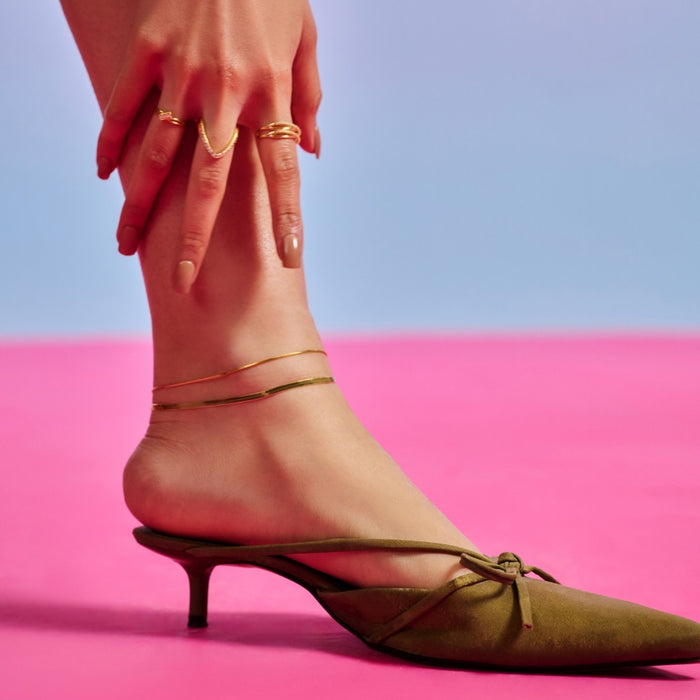 Women's layered gold 925 Sterling Silver snake chain anklet with green heels and rings. – Zavya