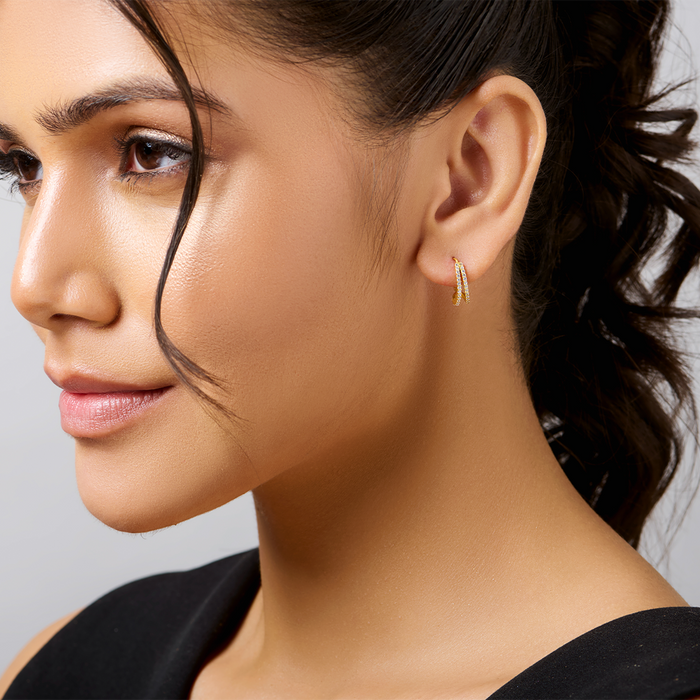 Woman wearing small gold plated 925 Sterling Silver hoop earrings. Classic women's jewellery – Zavya