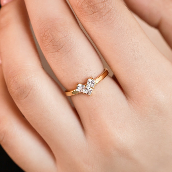 Woman wearing a gold-plated 925 Sterling Silver ring with cubic zirconia stones. Elegant rings for women – Zavya