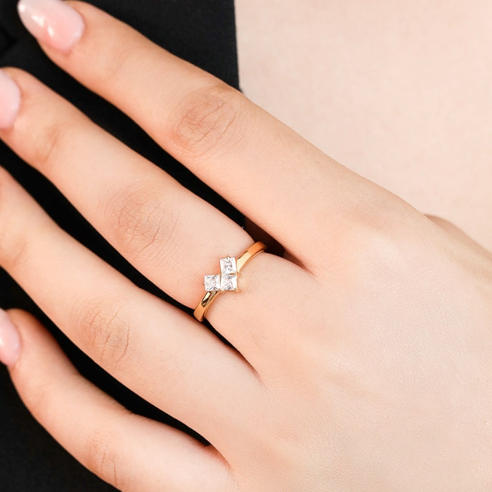 Woman's hand wearing a gold-plated 925 Sterling Silver ring with cubic zirconia. Women's jewellery – Zavya