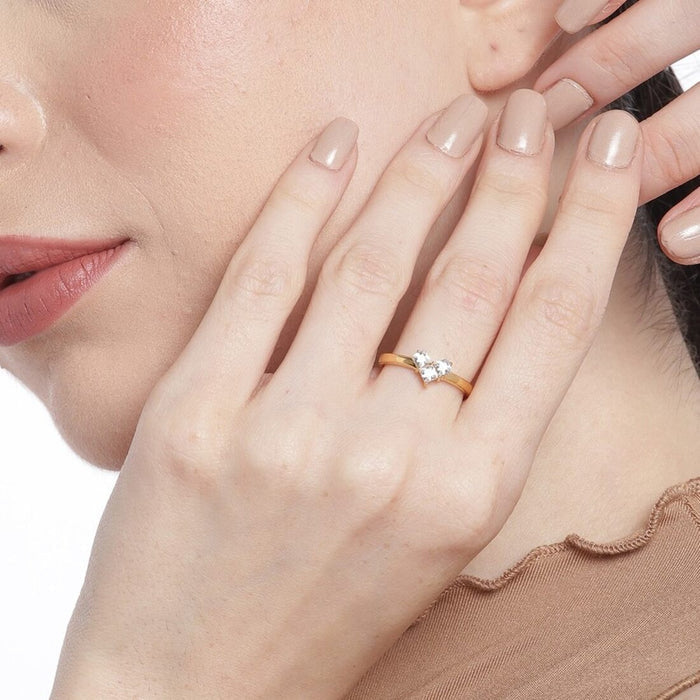 Woman wearing a gold-plated 925 Sterling Silver ring with a cubic zirconia heart. Jewellery for women – Zavya