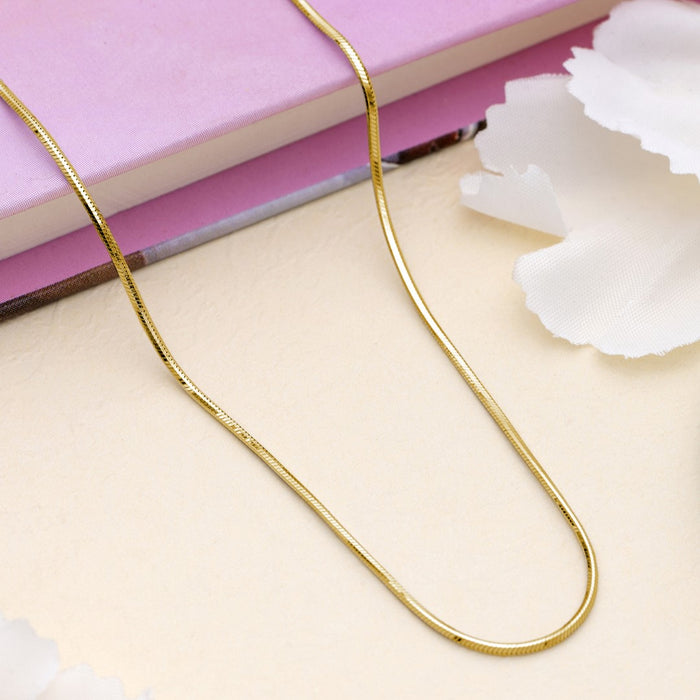 Gold plated 925 Sterling Silver serpent chain necklace for women on a pink book with white flowers – Zavya