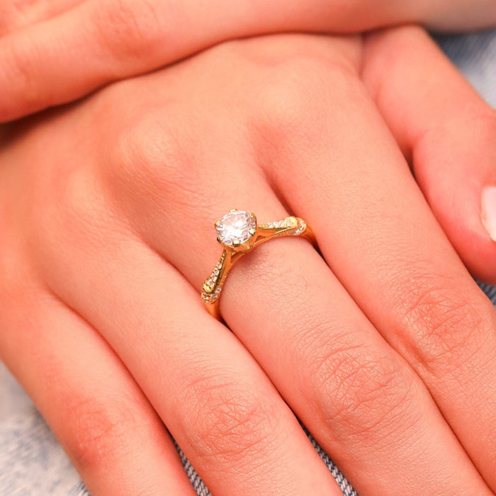 Woman wearing a 925 Sterling Silver gold plated couple ring with a center stone. Elegant rings for women. – Zavya