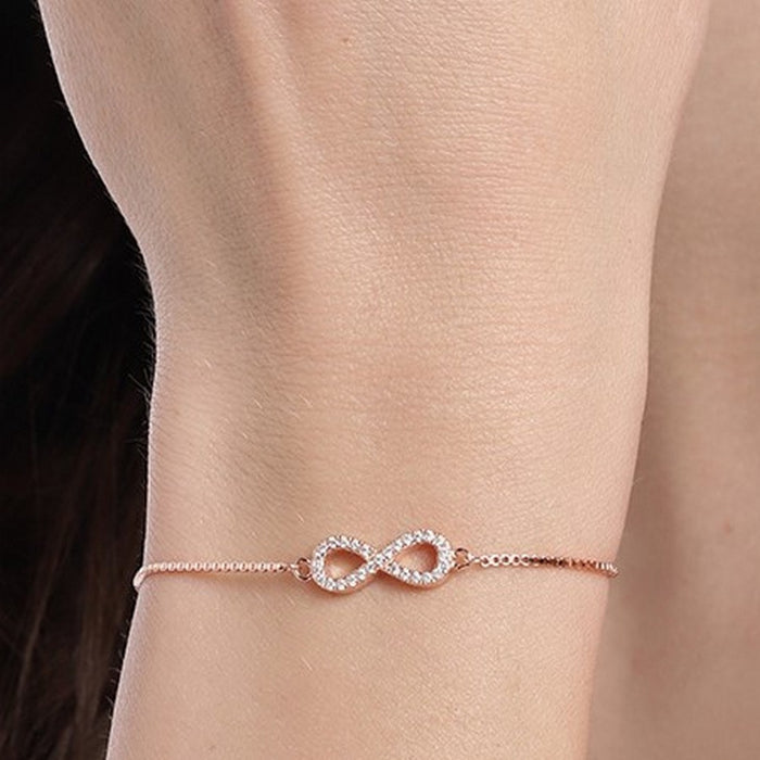 Woman wearing a rose gold minimal infinity 925 Sterling Silver bracelet. Jewellery for women – Zavya