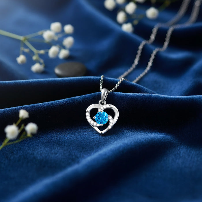 925 Sterling Silver necklace for women featuring a blue stone heart pendant on blue velvet – Zavya