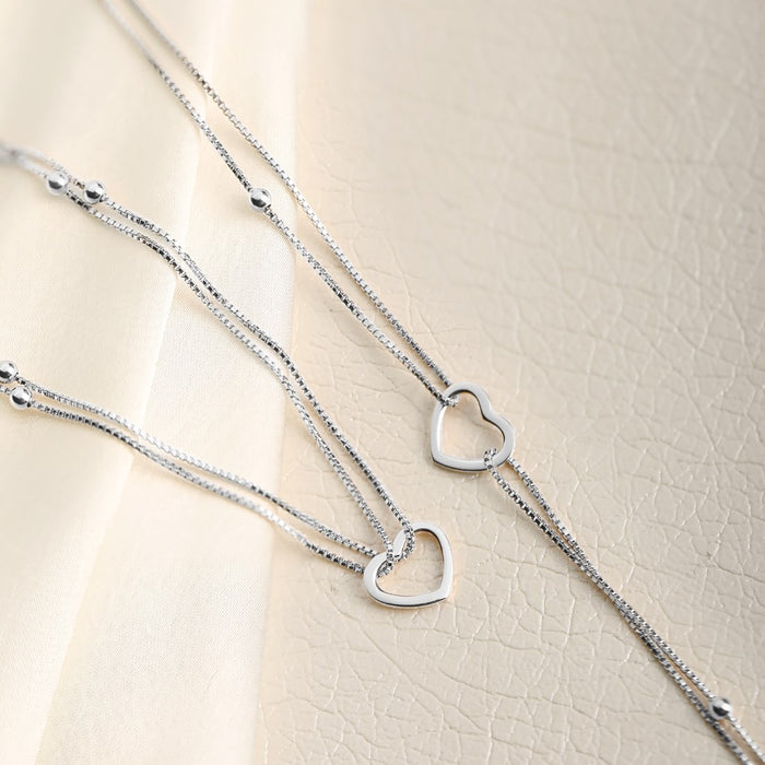 Women's layered 925 Sterling Silver anklet with delicate beaded chains and open heart charms – Zavya